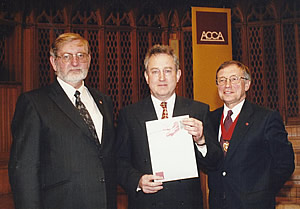 John Constance receiving his post-graduate certificate from the ACCA